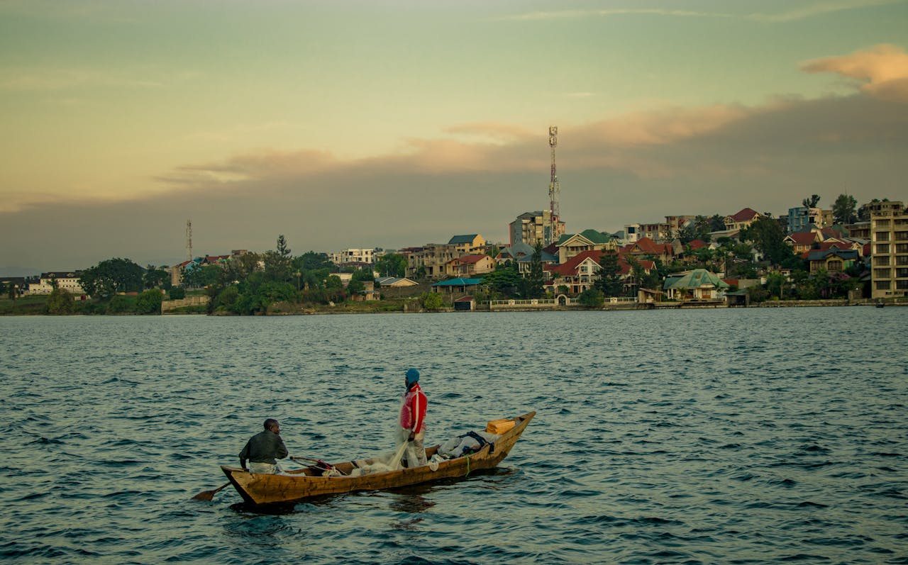 Menus Fishermen on Lake Kivu in Goma, Democratic Republic of Congo during sunset.